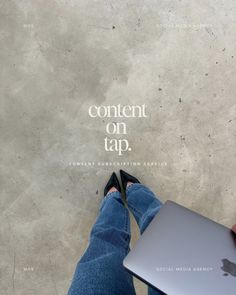 a person holding an apple laptop in their hand with the caption content on tap