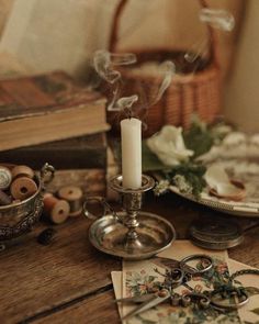 a table topped with candles and other items