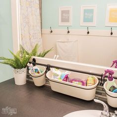 a bathroom sink with three baskets on it