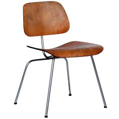 the eames chair is made from wood and metal