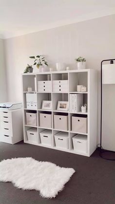 a room with white shelving and lots of storage