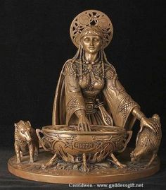 a bronze statue of a woman sitting in front of a bowl with animals around it