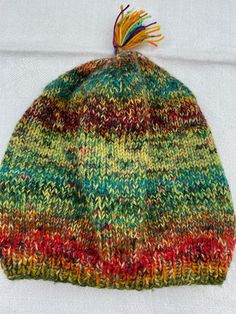 Multicolored hat Size: 48 cm in circumference, H 23,5 cm, very stretchable Removable tassel Combination of exclusive yarns 75 % wool, 25 % polyamid Knitted Wool Hats One Size Fits Most, Multicolor Wool Hat For Fall, One Size Knit Bonnet Cap, Brimmed Multicolor Hats For Fall, Multicolor Brimmed Hats For Fall, Multicolor Brimmed Fall Hats, Fall Multicolor Brimmed Hat, Knitted One Size Bonnet, One Size Knitted Bonnet