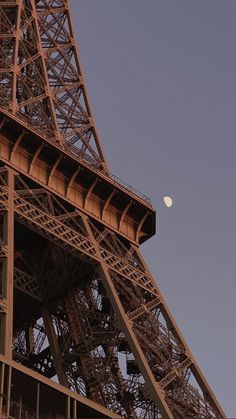 the eiffel tower is very tall and has a clock on it's side