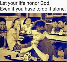 a group of children sitting at desks eating food