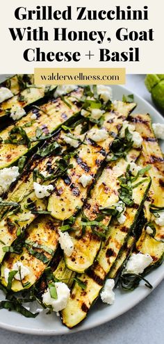 grilled zucchini with honey, goat cheese and basil on a white plate