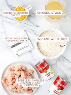 ingredients to make chicken broth laid out on a white marble counter top with text overlay