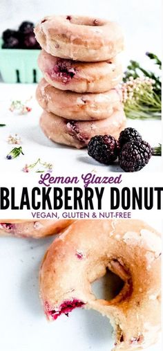 a stack of doughnuts sitting on top of each other next to berries and blackberries