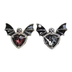 two pairs of earrings with crystals and bats on the front, one is black and white