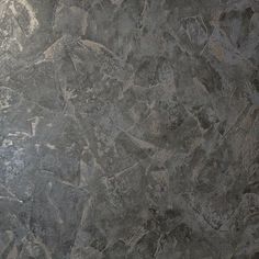 a black and gray marble floor with some cracks in the top part of it that looks like something out of space