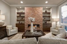 a living room filled with furniture and a fire place in the middle of a room