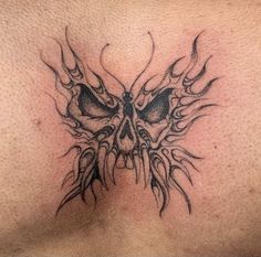 a close up of a tattoo on the chest