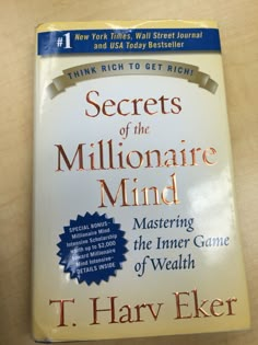 the book secrets of the millionaire mind by t harry elker on a table