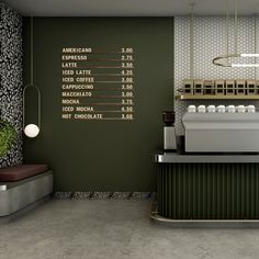 a coffee shop with green walls and white counter tops, along with an array of items on the wall