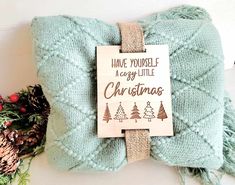 a wooden sign that says have yourself a merry little christmas with pine trees on it