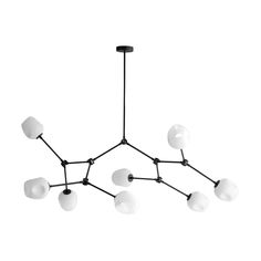 a black and white chandelier with five lights hanging from it's ceiling