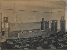 an old black and white photo of a classroom