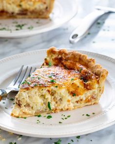 a slice of quiche on a plate with a fork