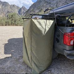 the back end of a truck with a tarp over it