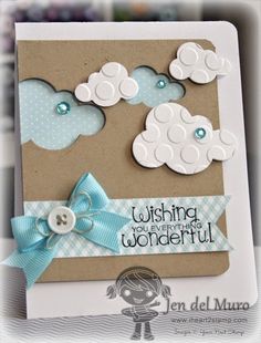 a card with some buttons on it and a blue ribbon around the bottom of the card