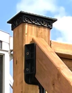 a close up of a wooden structure with a sky background