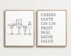 two black and white posters with wine glasses on them, one has the words cheers santa fe