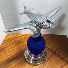 a model airplane sitting on top of a wooden table