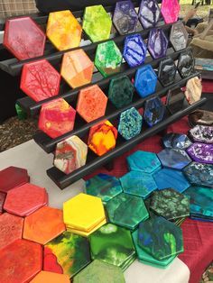 there are many different colored hexagonals on the table