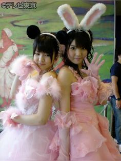 two girls dressed up in bunny ears and pink dresses