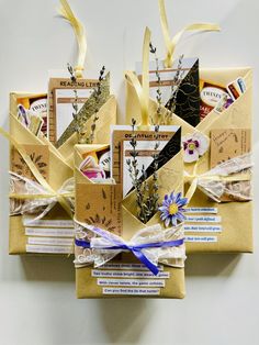 an assortment of items are wrapped in brown paper and tied with yellow twine ribbons