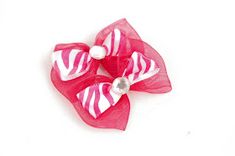 a pink and white hair bow on a white background