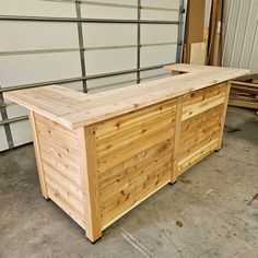 a wooden counter sitting in front of a garage door