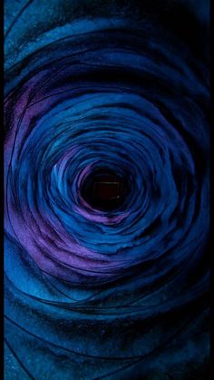 the inside of a blue and purple swirl