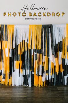 an orange, black and white streamer is hanging on the wall