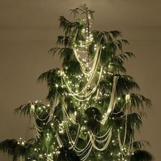 a christmas tree is decorated with lights and ornaments