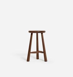 a wooden stool on a white background