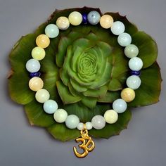 - Handcrafted 8mm Beads Amazonite W/ Lapis Lazuli Bracelet W/ A Gold Tone Ohm Charm Size: 8", However The Feel Will Fit Like A 7.5" - 8" Because Of The Size Of The Beads.. Amazonite Is Associated With The Throat And Heart Chakras, And Lapis Lazuli Can Help Magnify Amazonite's Healing Properties And Boost Positive Energy Posh Embassador 5 Star Seller Fast Shipping Carefully Packaged Smoke Free Home Tags: #Chakra #Gemstone #Handcrafted #Handmade #Stretch #Lotus #Buddha #Prayer #Mala #Gift #Birthda Lotus Buddha, Lapis Lazuli Bracelet, 8mm Beads, Handcrafted Accessories, Mens Accessories Jewelry, Healing Properties, Positive Energy, Lapis Lazuli, Gemstone Beads