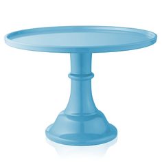 a blue cake plate sitting on top of a white table