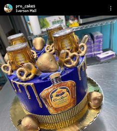 a blue cake with gold decorations on it