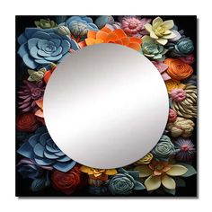 a mirror with flowers on it and an orange flower in the center is surrounded by black background