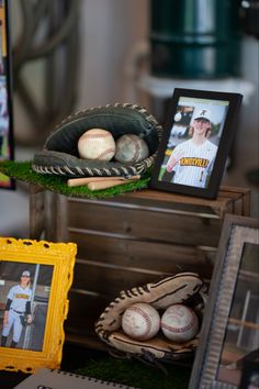 baseball memorabilia and photos are displayed on a table