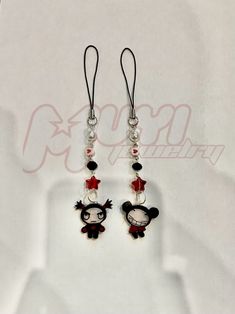 pair of mickey mouse earrings with red and black beaded earwires on white background