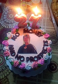 a birthday cake with candles on top of it that reads 27 mom's no prob