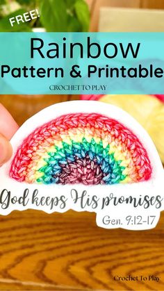 the rainbow crochet pattern and printable sticker is being held by someone's hand