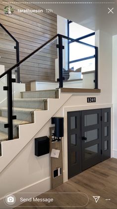 the stairs in this house are made of wood and metal, with glass doors on each side