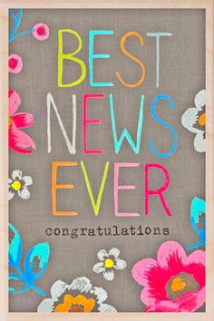 the words best news ever written in colored chalk on a gray background with colorful flowers