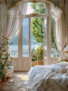 a bedroom with an open window and white curtains on the windowsill, overlooking a body of water