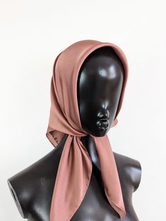 Dusky pink satin headscarf Luxury modern bohemian satin headscarf. This is made from a soft synthetic blend satin fabric. The fabric is luxurious and lightweight. This scarf is versatile and can be worn in many ways around the neck or head. It is large enough to be tied around the head to give full coverage, or to be draped around the neck.  This is a square scarf that can be folded to create the triangle look, or wrapped up and tied in a knot to be worn as a headband. Style: Head scarf Measurements:  Width: 28 inches (71 cm)  Length: 28 inches (71 cm)   Fabric: Non stretch satin  Colour: Pink Elegant Pink Bandana, Pink Satin Scarf For Summer, Chic Pink Satin Silk Scarf, Elegant Pink Satin Scarves, Elegant Pink Satin Scarf, Bandana Hair Wrap, Style Head Scarf, Head Scarf Vintage, Style Bandana