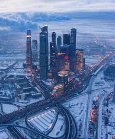 an aerial view of a city in the snow