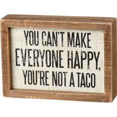 a wooden box sign that says you can't make everyone happy, you're not a taco